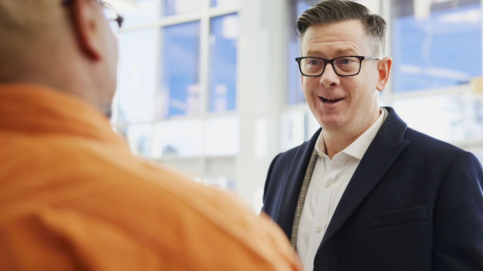 Two people discussing a business idea during an interview.