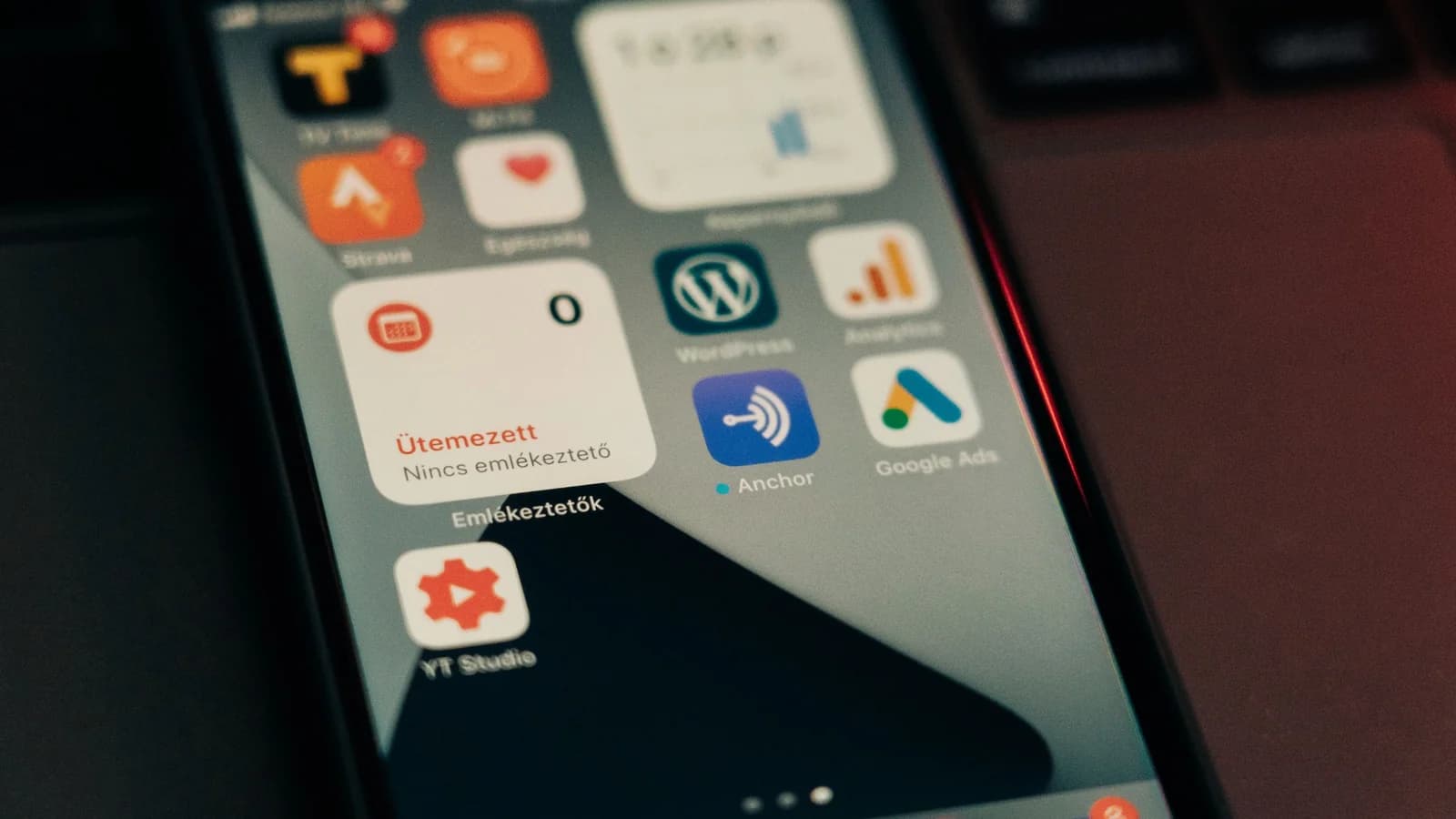 A smartphone home screen showing apps and notification widgets.